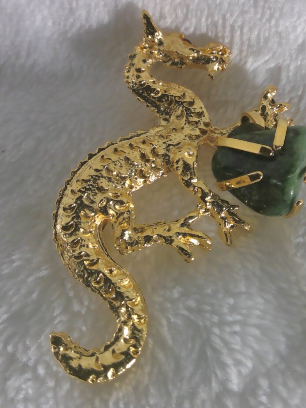 Goldtone platted dragon holding faux jade stone
